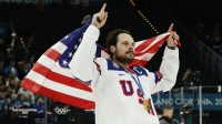 Auston Matthews #34 of Team United States celebrates after the game against Team Canada during the Milano Cortina 2026 Olympic Winter Games at Milano Santagiulia Ice Hockey Arena