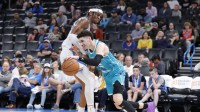 Oklahoma City Thunder guard Shai Gilgeous-Alexander (2) defends a drive by Charlotte Hornets guard LaMelo Ball (2) during the second half at Paycom Center.
