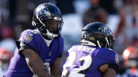 Baltimore Ravens quarterback Lamar Jackson (8) hands off the ball to Baltimore Ravens running back Derrick Henry (22) in the first quarter of the NFL football game at Paycor Stadium in Cincinnati on Dec. 14, 2025.