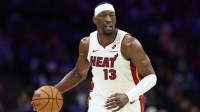 Miami Heat center Bam Adebayo (13) dribbles up court against the Philadelphia 76ers during the first quarter at Xfinity Mobile Arena.