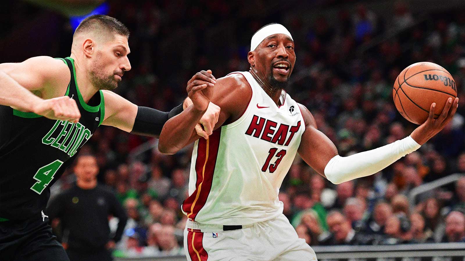 Boston Celtics center Nikola Vucevic defends Miami Heat center Bam Adebayo (13) during the first half at TD Garden. 