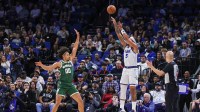 Orlando Magic forward Paolo Banchero (5) shoots a three point basket over Milwaukee Bucks center Jericho Sims (00) during the first quarter at Kia Center.