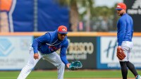 New York Mets infielder Mark Vientos (left) works with infielder Bo Bichette (right) during spring training at Clover Park.