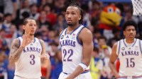 Kansas Jayhawks guard Darryn Peterson (22) enters the court with Kansas Jayhawks guard Tre White (3) and Kansas Jayhawks forward Bryson Tiller (15) during the game against Houston Cougars inside Allen Fieldhouse on Monday, Feb. 23, 2026.