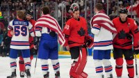 Jordan Binnington (50) of Canada shakes hands with Untied States players after the men's ice hockey gold medal game during the Milano Cortina 2026 Olympic Winter Games at Milano Santagiulia Ice Hockey Arena