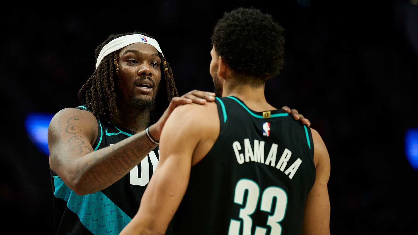 Trail Blazers center Robert Williams III (35) talks to forward Toumani Camara (33) during the second half against the Oklahoma City Thunder at Moda Center