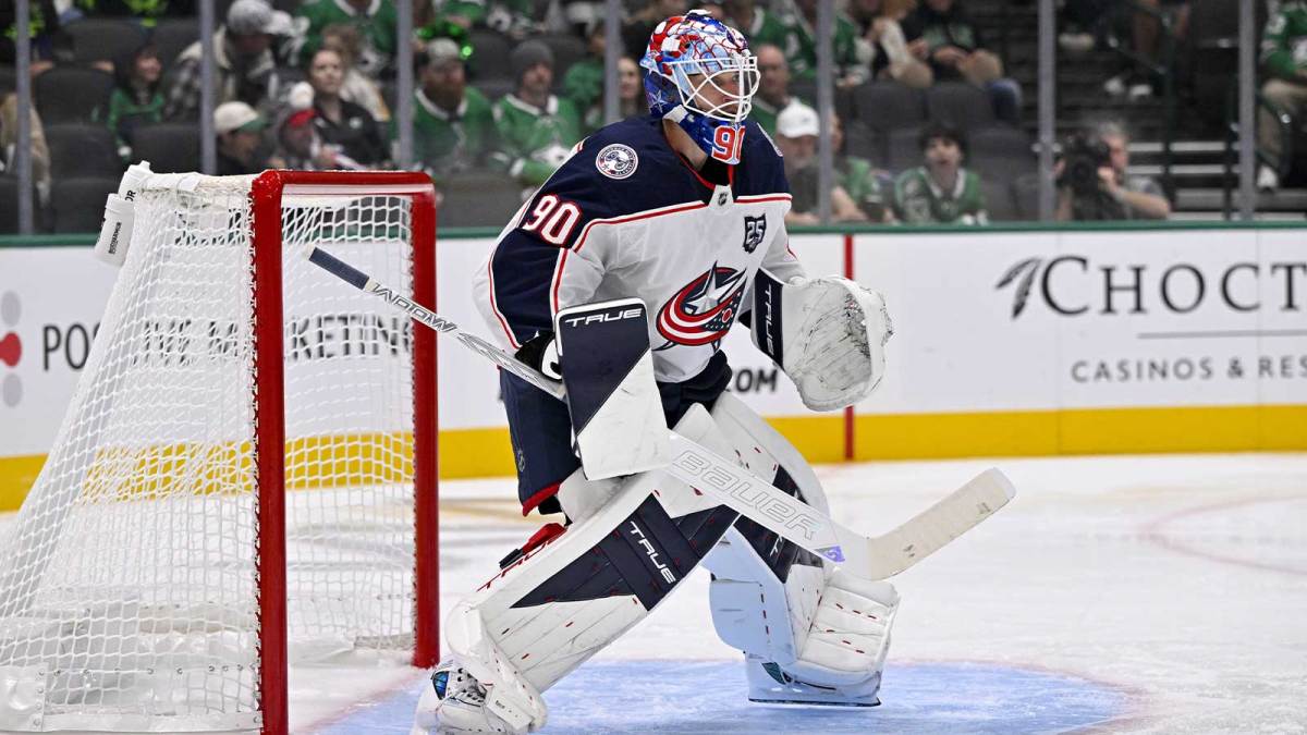 Columbus Blue Jackets goaltender Elvis Merzlikins (90) faces the Dallas Stars attack during the game between the Stars and the Blue Jackets at the American Airlines Center.