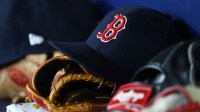 A detail view of Boston Red Sox hats and gloves at Tropicana Field.