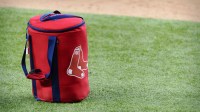 A view of the Boston Red Sox logo and a field bag during batting practice before the game between the Texas Rangers and the Boston Red Sox at Globe Life Field.