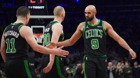Boston Celtics guard Derrick White (9) congratulates guard Payton Pritchard (11) after making a basket during the second half against the Miami Heat at TD Garden