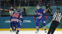 Brady Tkachuk of United States celebrates scoring their second goal with Charlie McAvoy of United States against Denmark in men's ice hockey group C play during the Milano Cortina 2026 Olympic Winter Games at Milano Santagiulia Ice Hockey Arena.