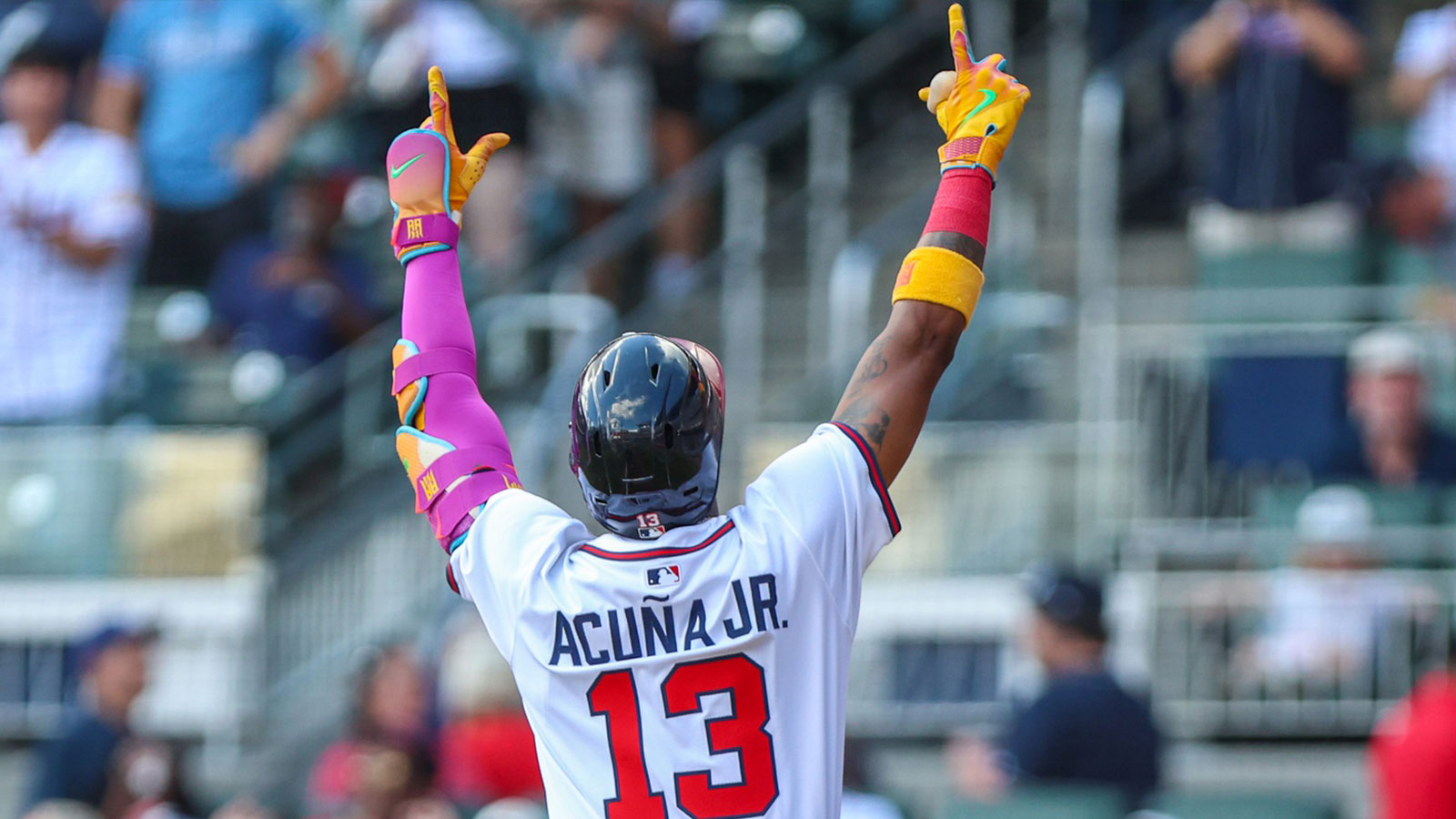 Atlanta Braves outfielder Ronald Acuna Jr. (13) celebrates after hitting a home run against the Pittsburgh Pirates during the first inning at Truist Park.