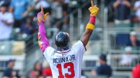 Atlanta Braves outfielder Ronald Acuna Jr. (13) celebrates after hitting a home run against the Pittsburgh Pirates during the first inning at Truist Park.