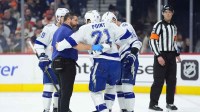 Tampa Bay Lightning center Brayden Point (21) is assisted after an injury against the Philadelphia Flyers in the second period at Xfinity Mobile Arena.