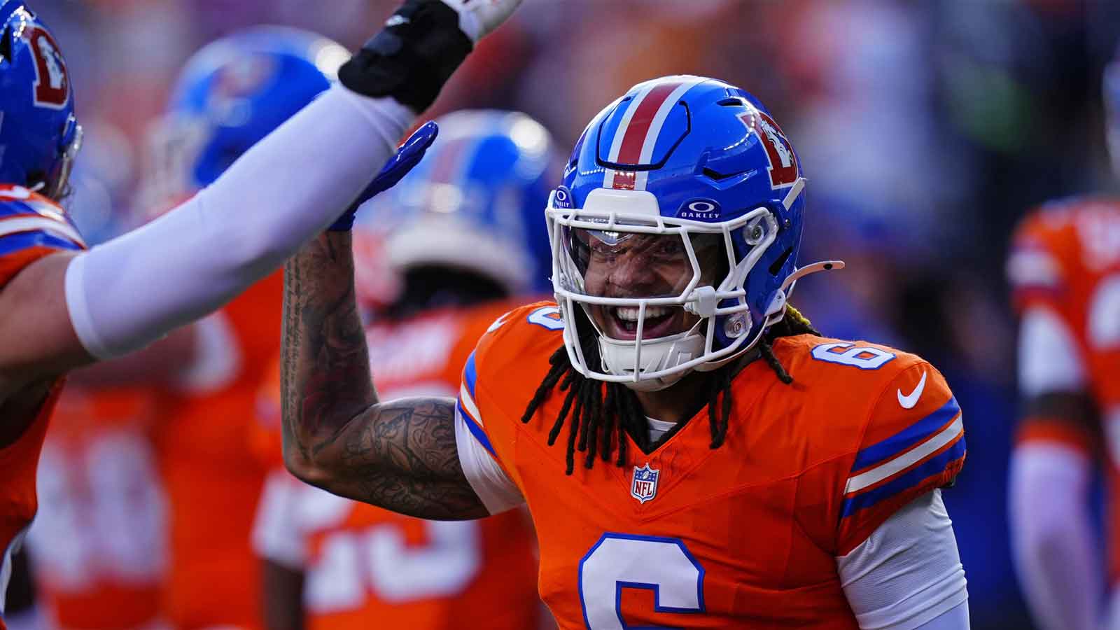 Denver Broncos safety P.J. Locke (6) smiles during the first half against the Los Angeles Chargers at Empower Field at Mile High.