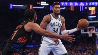 Milwaukee Bucks forward Giannis Antetokounmpo (34) looks to pass as New York Knicks guard Jalen Brunson (11) defends during the first half at Madison Square Garden.