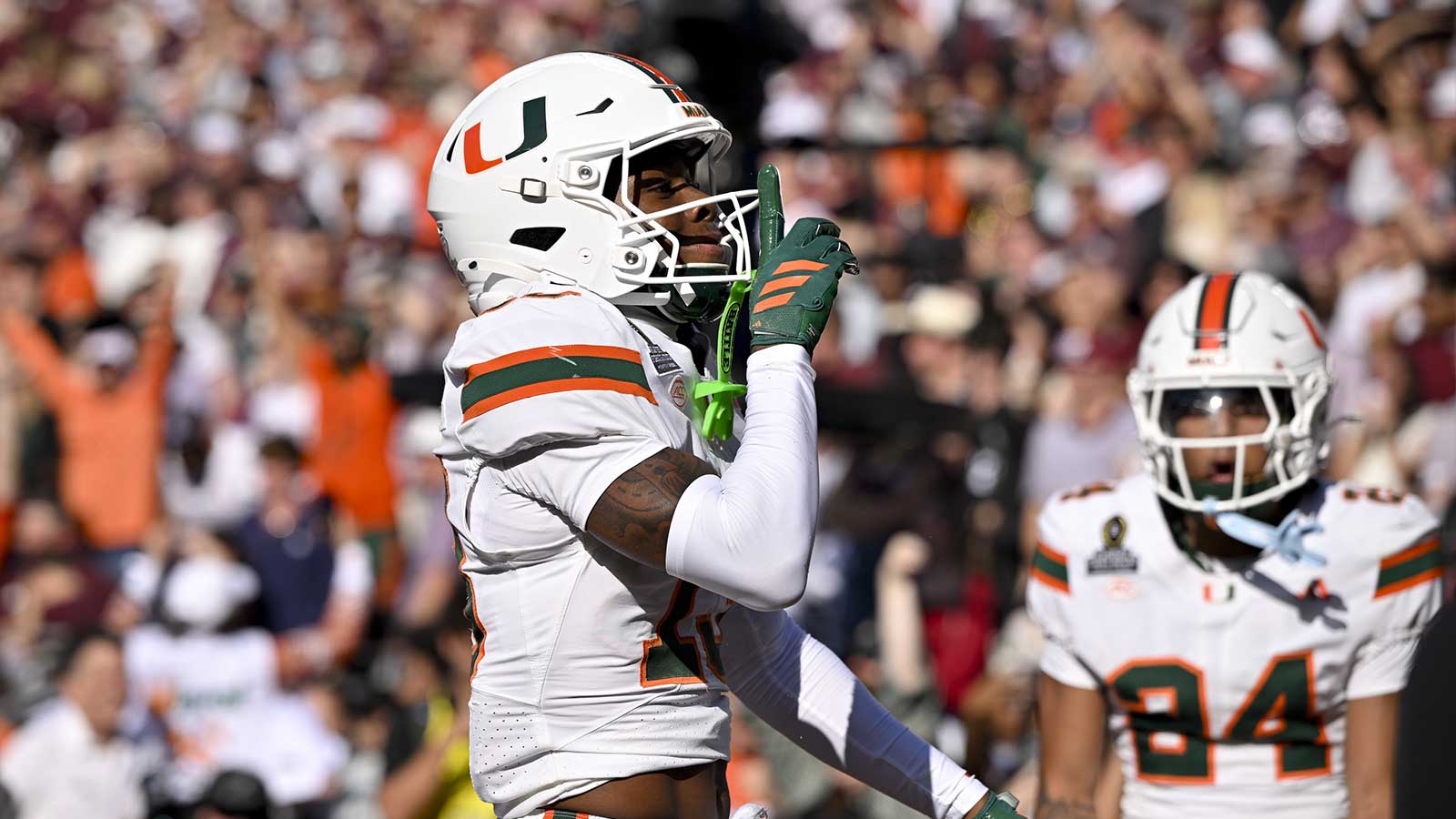 Miami Hurricanes defensive back Bryce Fitzgerald (13) motions to the fans after he intercepts a Texas A&M Aggies pass to clinch the Miami win at Kyle Field.