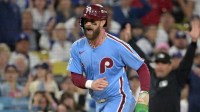 Philadelphia Phillies first baseman Bryce Harper (3) reacts as he scores a run during the fourth inning in game three of the NLDS against the Los Angeles Dodgers during the 2025 MLB playoffs at Dodger Stadium.