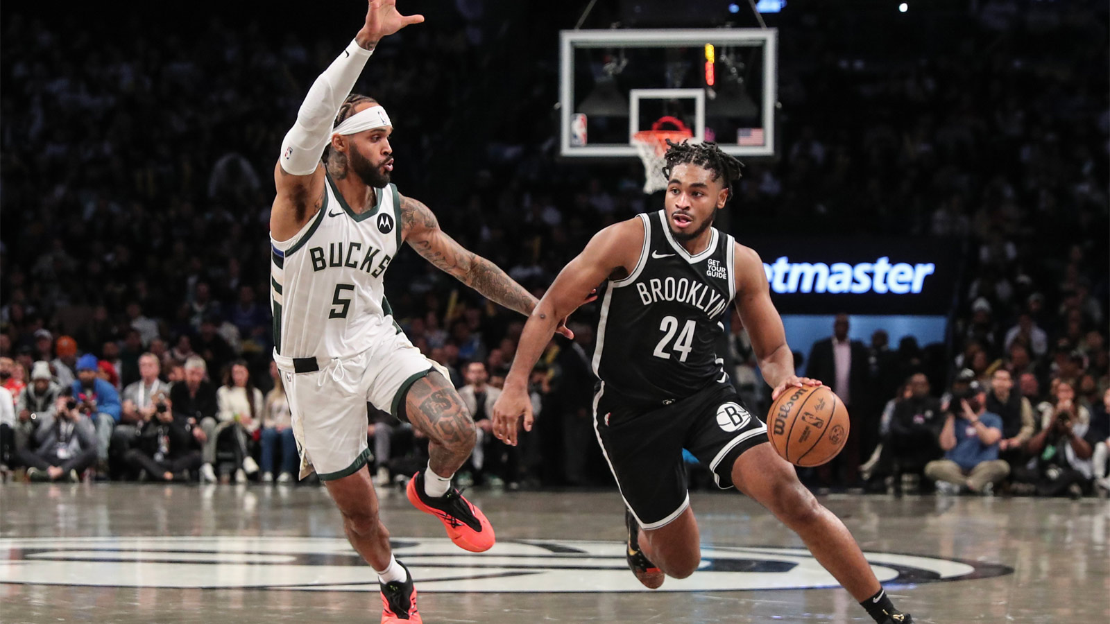 Nets guard Cam Thomas (24) drives past Milwaukee Bucks guard Gary Trent Jr. (5) in the fourth quarter at Barclays Center