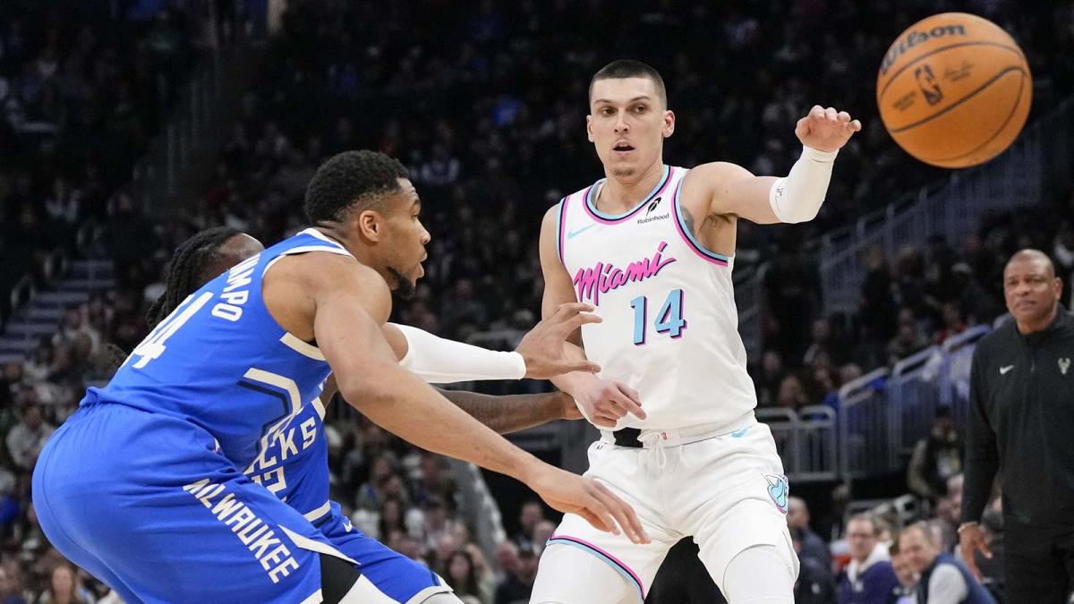 Miami Heat guard Tyler Herro (14) passes the ball away from Milwaukee Bucks forward Giannis Antetokounmpo (34) during the third quarter at Fiserv Forum