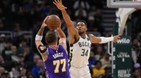 Bucks' Giannis Antetokounmpo defends Lakers' Luka Doncic