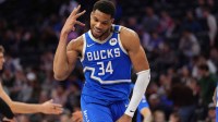 Bucks forward Giannis Antetokounmpo (34) reacts against the Philadelphia 76ers in the fourth quarter at Wells Fargo Center with ESPN's Bobby Marks in the background