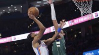 Oklahoma City Thunder guard Isaiah Joe (11) shoots against Milwaukee Bucks forward Ousmane Dieng (21) during the second half at Paycom Center