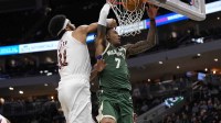 Bucks guard Kevin Porter Jr. (7) dunks against