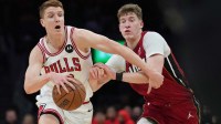 Jan 31, 2026; Miami, Florida, USA; Chicago Bulls guard Kevin Huerter (13) drives past Miami Heat guard Kasparas Jakucionis (25) during the first half at Kaseya Center. Mandatory Credit: Jim Rassol-Imagn Images