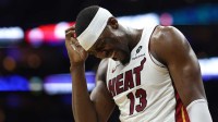 Miami Heat center Bam Adebayo (13) reacts after a collision during the first quarter against the Philadelphia 76ers at Xfinity Mobile Arena.