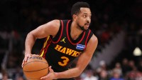 Atlanta Hawks guard CJ McCollum (3) handles the ball against the Miami Heat in the fourth quarter at State Farm Arena.