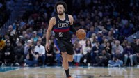 Detroit Pistons guard Cade Cunningham (2) brings the ball up court during the second half against the Charlotte Hornets at Spectrum Center.