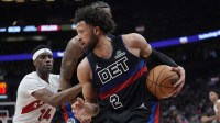 Detroit Pistons guard Cade Cunningham (2) controls the ball against Toronto Raptors guard Ja'Kobe Walter (14) during the second half at Scotiabank Arena.