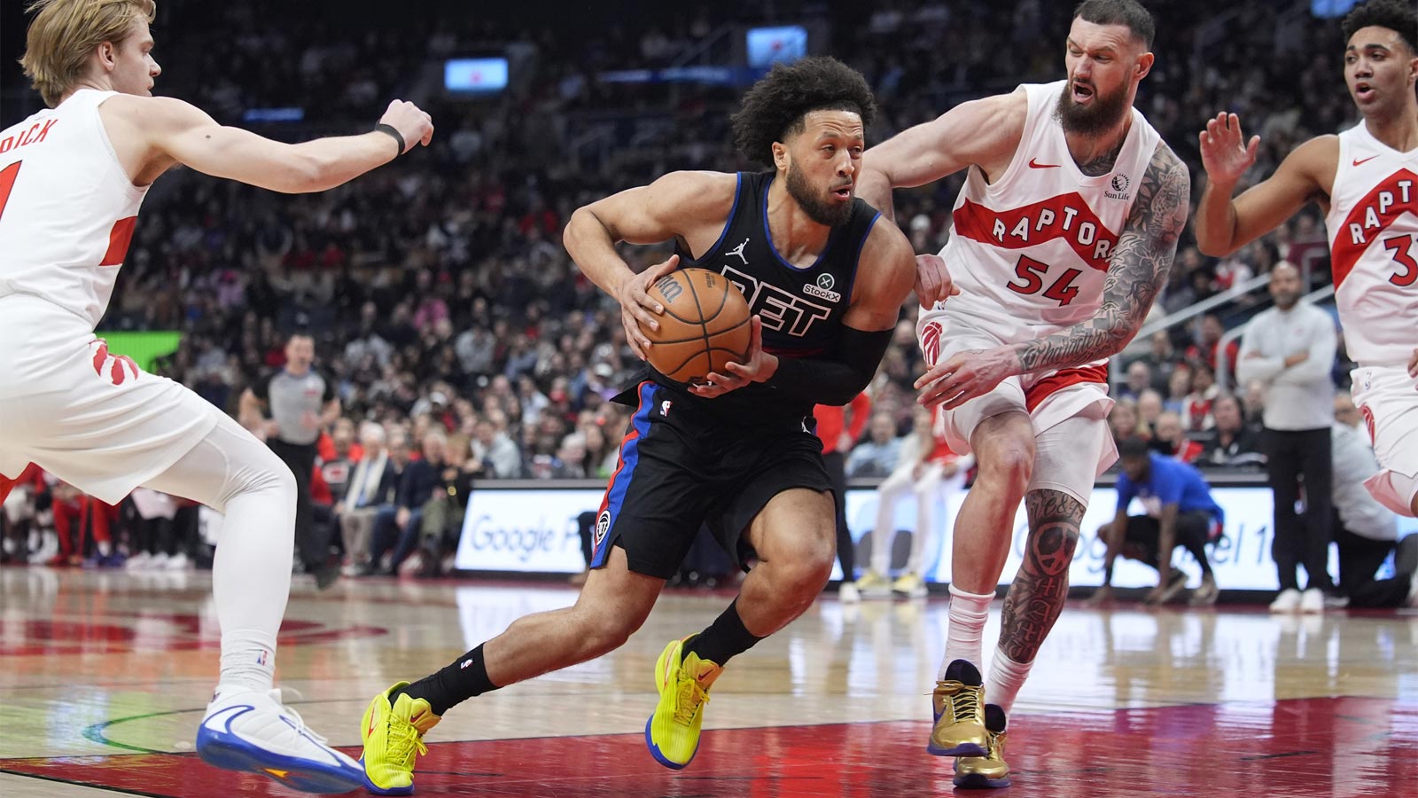 Detroit Pistons guard Cade Cunningham (2) drives to the net against Toronto Raptors forward Sandro Mamukelashvili (54) during the first half at Scotiabank Arena. 