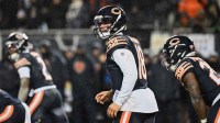 Chicago Bears quarterback Caleb Williams (18) calls the snap count from shotgun formation against the Los Angeles Rams during the third quarter of an NFC Divisional Round game at Soldier Field.