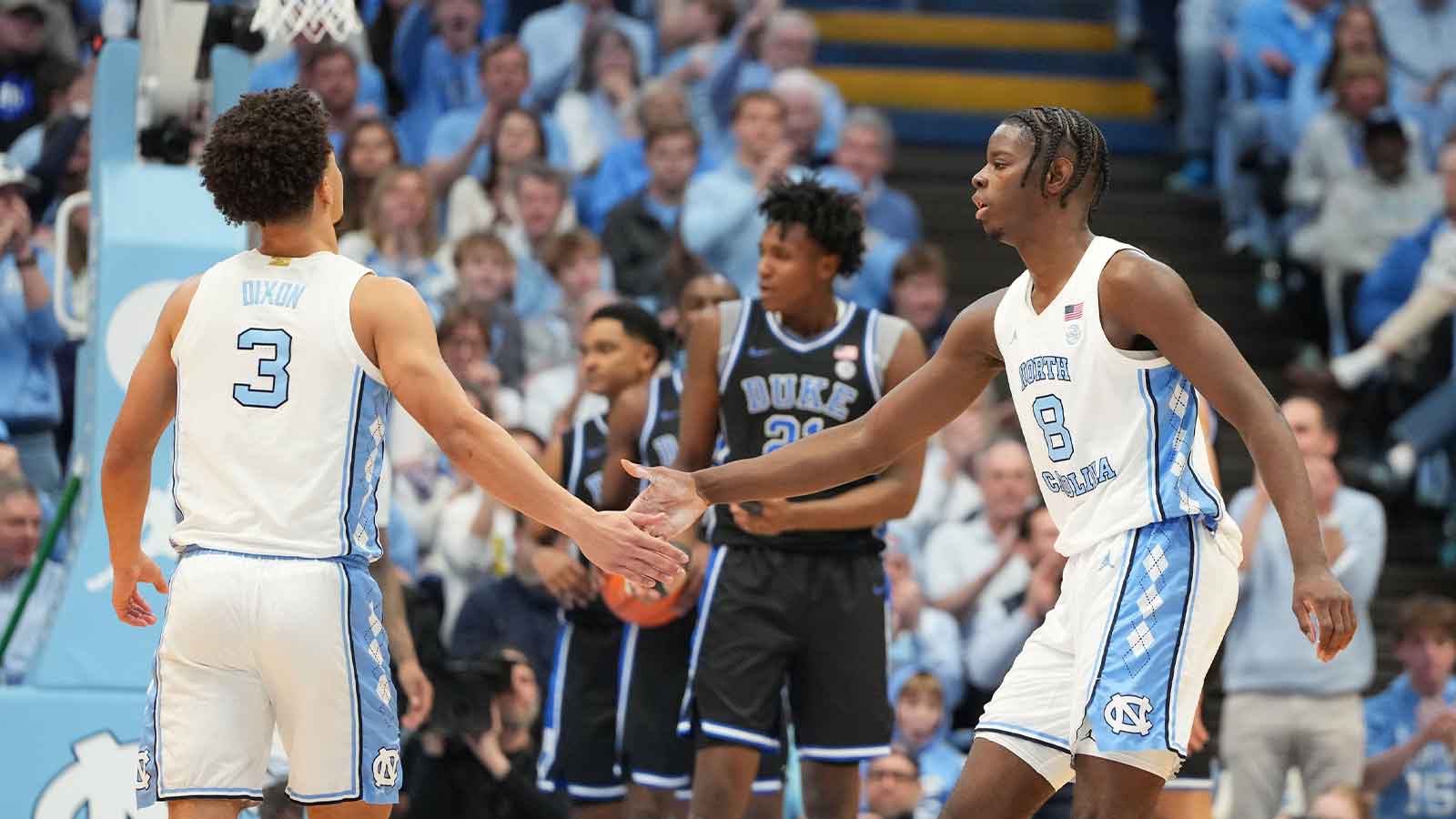 North Carolina Tar Heels forward Caleb Wilson (8) reacts with guard Derek Dixon (3) in the first half at Dean E. Smith Center.