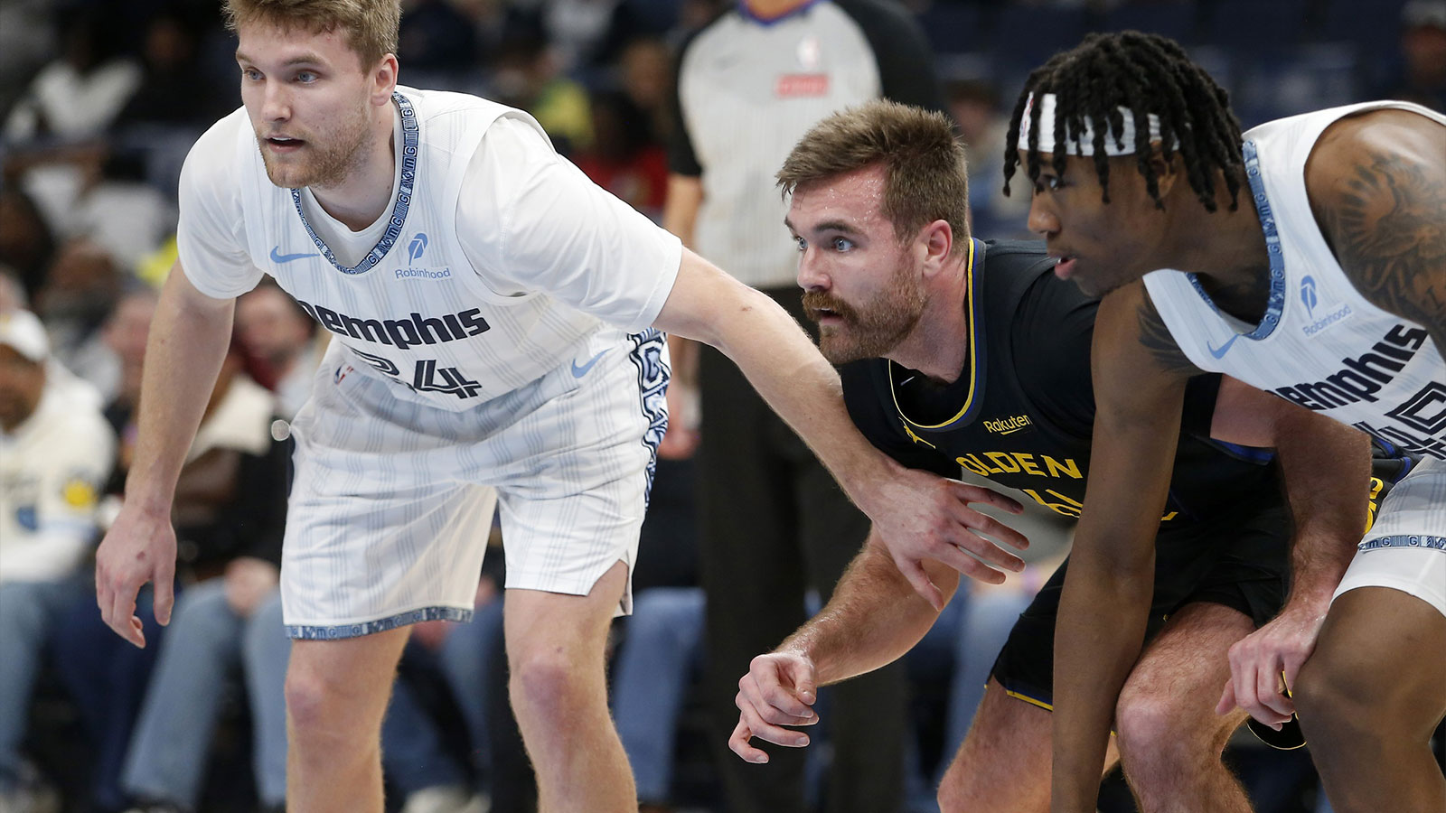 Memphis Grizzlies guard Cam Spencer (24) and Golden State Warriors guard Pat Spencer (61) line up for a free throw during the third quarter at FedExForum.