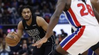 Brooklyn Nets guard Cam Thomas (24) dribbles defended by Detroit Pistons forward Isaiah Stewart (28) in the first half at Little Caesars Arena.