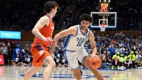 Duke Blue Devils forward Cameron Boozer (12) drives to the basket as Clemson Tigers forward Carter Welling (22) defends during the second half at Cameron Indoor Stadium.