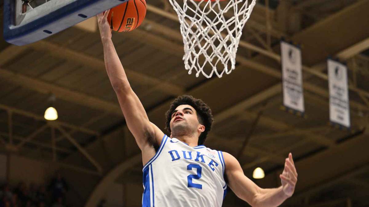 Duke Blue Devils guard Cayden Boozer (2) lays the ball up for a basket against the Syracuse Orange during the during the second half at Cameron Indoor Stadium.