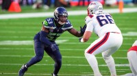 Seattle Seahawks linebacker Boye Mafe (53) rushes against New England Patriots offensive tackle Will Campbell (66) during the second quarter in Super Bowl LX at Levi's Stadium.