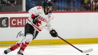 Canada's Marie-Philip Poulin looks for a pass at the Adirondack Bank Center in Utica, N.Y. on April 5, 2024.