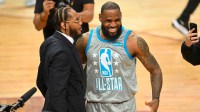 Team LeBron forward LeBron James celebrates after making the game winning shot with Carmelo Anthony during the 2022 NBA All-Star Game at Rocket Mortgage FieldHouse. Mandatory Credit: David Richard-Imagn Images