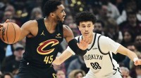 Brooklyn Nets guard Nolan Traore (88) defends Cleveland Cavaliers guard Donovan Mitchell (45) during the first quarter at Rocket Arena.