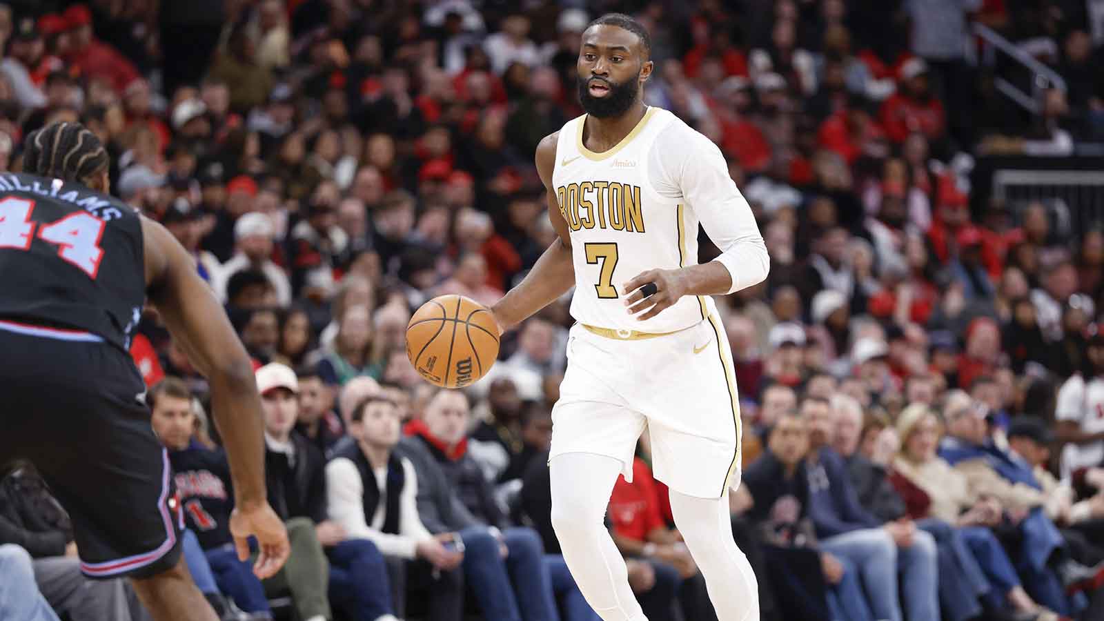 Boston Celtics guard Jaylen Brown (7) brings the ball up court against the Chicago Bulls during the second half at United Center.