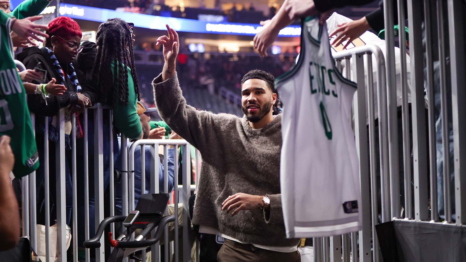 Celtics forward Jayson Tatum (0) celebrates with fans after a victory over the Atlanta Hawks at State Farm Arena