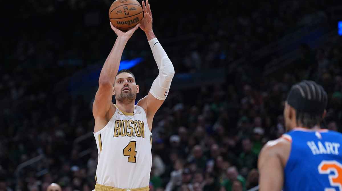 Celtics center Nikola Vucevic (4) shoots the ball against the New York Knicks in the second half at TD Garden
