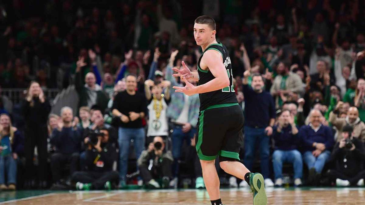 Boston Celtics guard Payton Pritchard (11) reacts after making a three point basket during the second half against the Miami Heat at TD Garden.