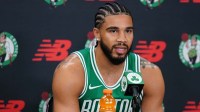 Boston Celtics forward Jayson Tatum (0) talks with reporters during media day at the Auerbach Center.