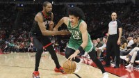 Boston Celtics guard Ron Harper Jr. (13) dribbles the ball as Houston Rockets forward Kevin Durant (7) defends during the third quarter at Toyota Center. Mandatory Credit: Troy Taormina-Imagn Images